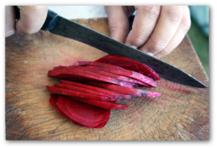 cutting thin sliced beets