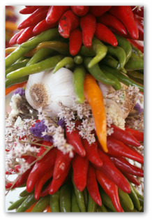 jalapeno peppers stacked with garlic