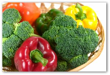 fresh broccoli and bell peppers in a bowl