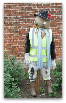 scarecrow dressed as gardener